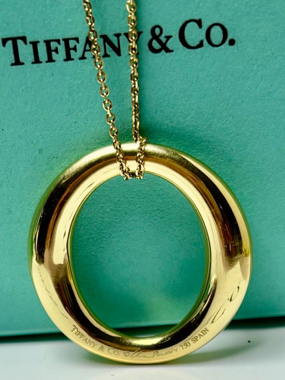 Tiffany & Co.  Sevillana by Elsa Peretti Smooth Oval 18k yellow gold Pendant.